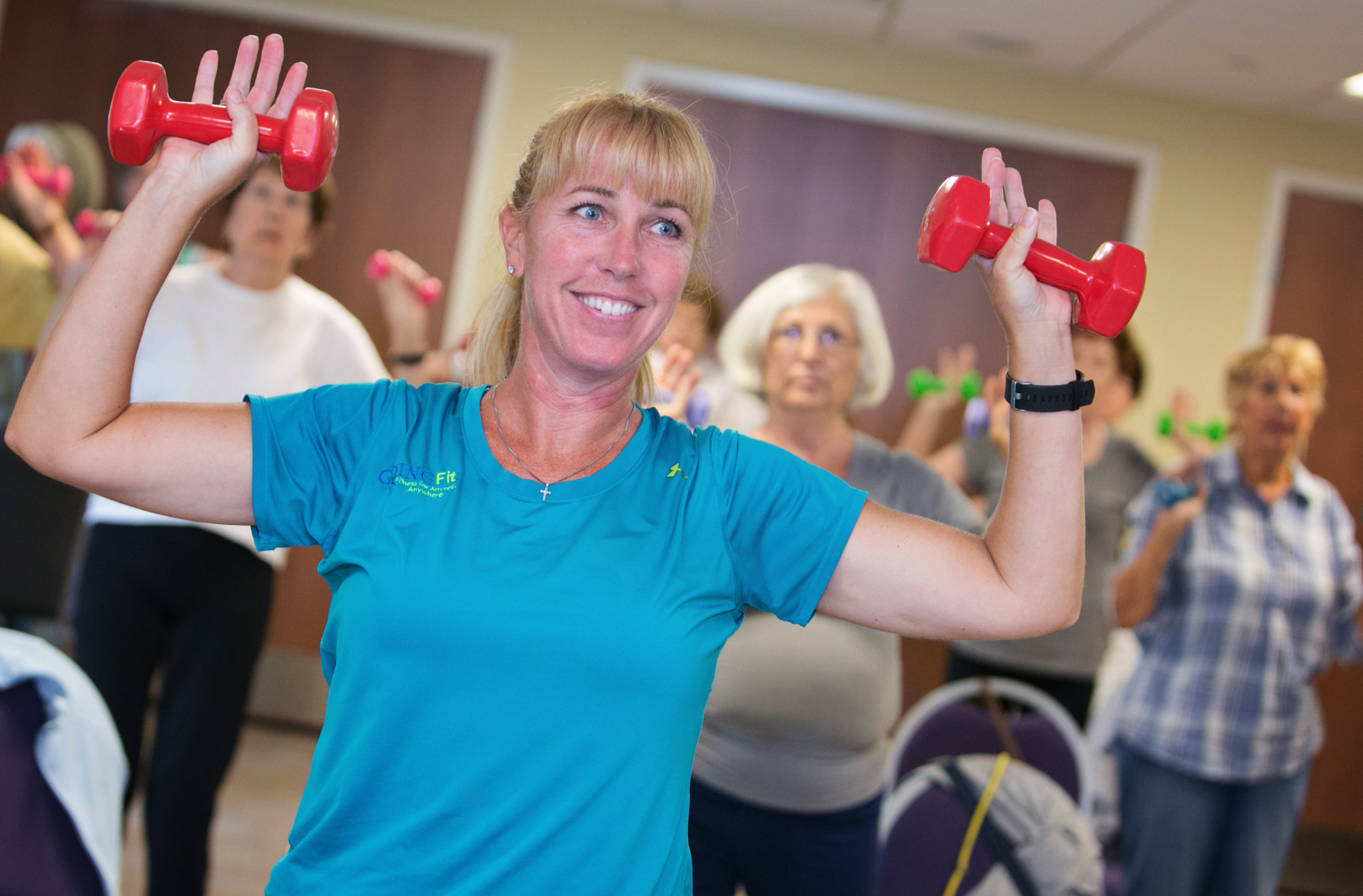 woman exercising with hand weights